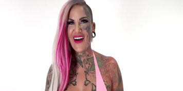 Big titty inked up hottie rides a big vibrating toy