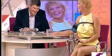 Cuddly blonde giving at interview and demonstrating her sexy legs